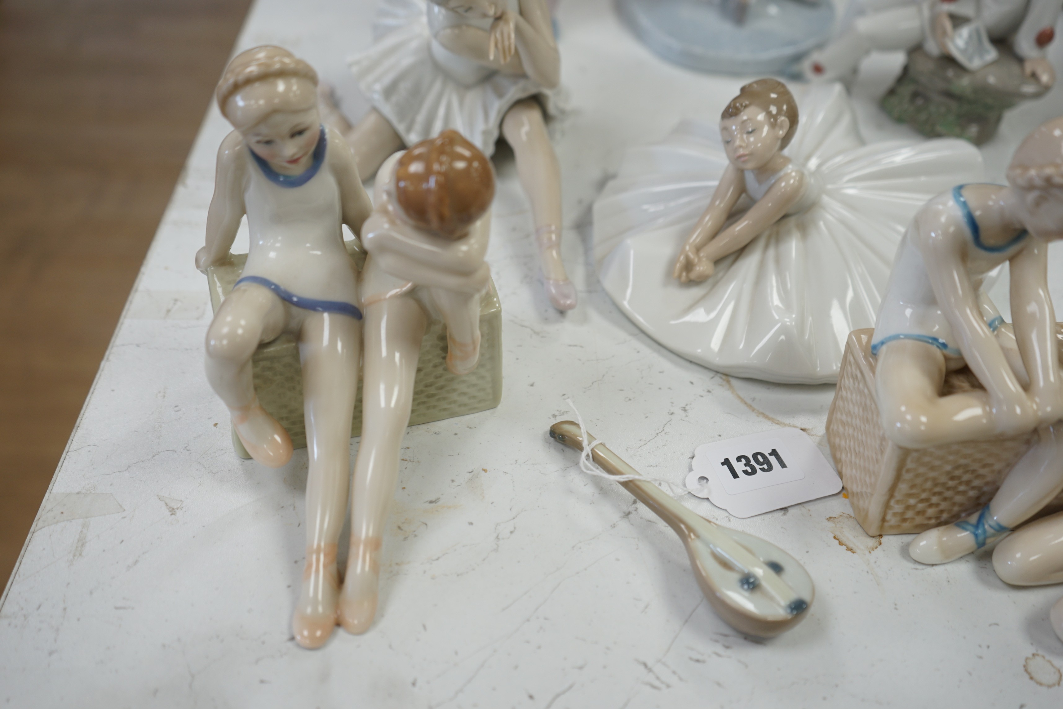 Seven various ceramic figures including Lladro, Nao and Doulton, tallest 33cm